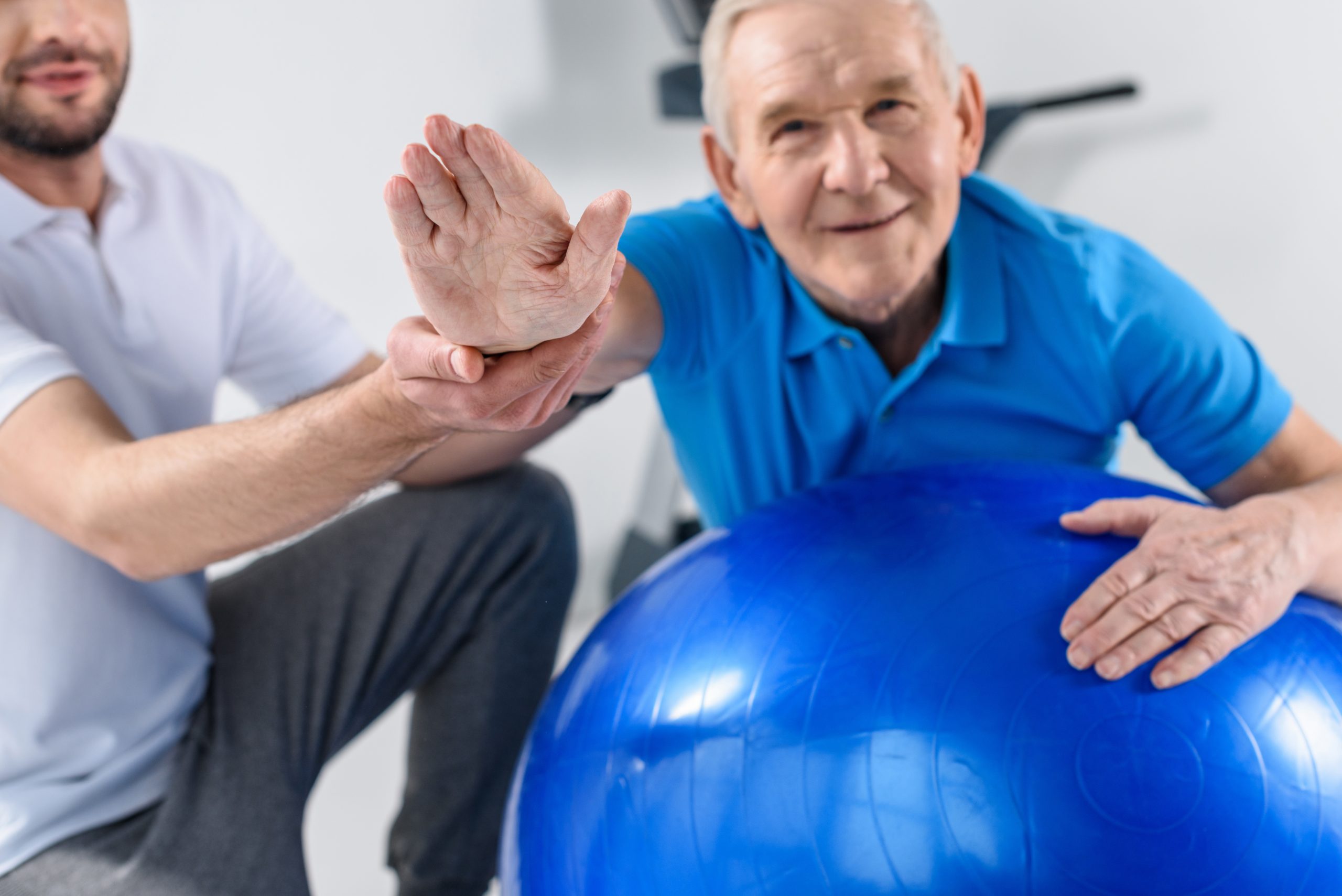 Senior Man working on an exercise ball