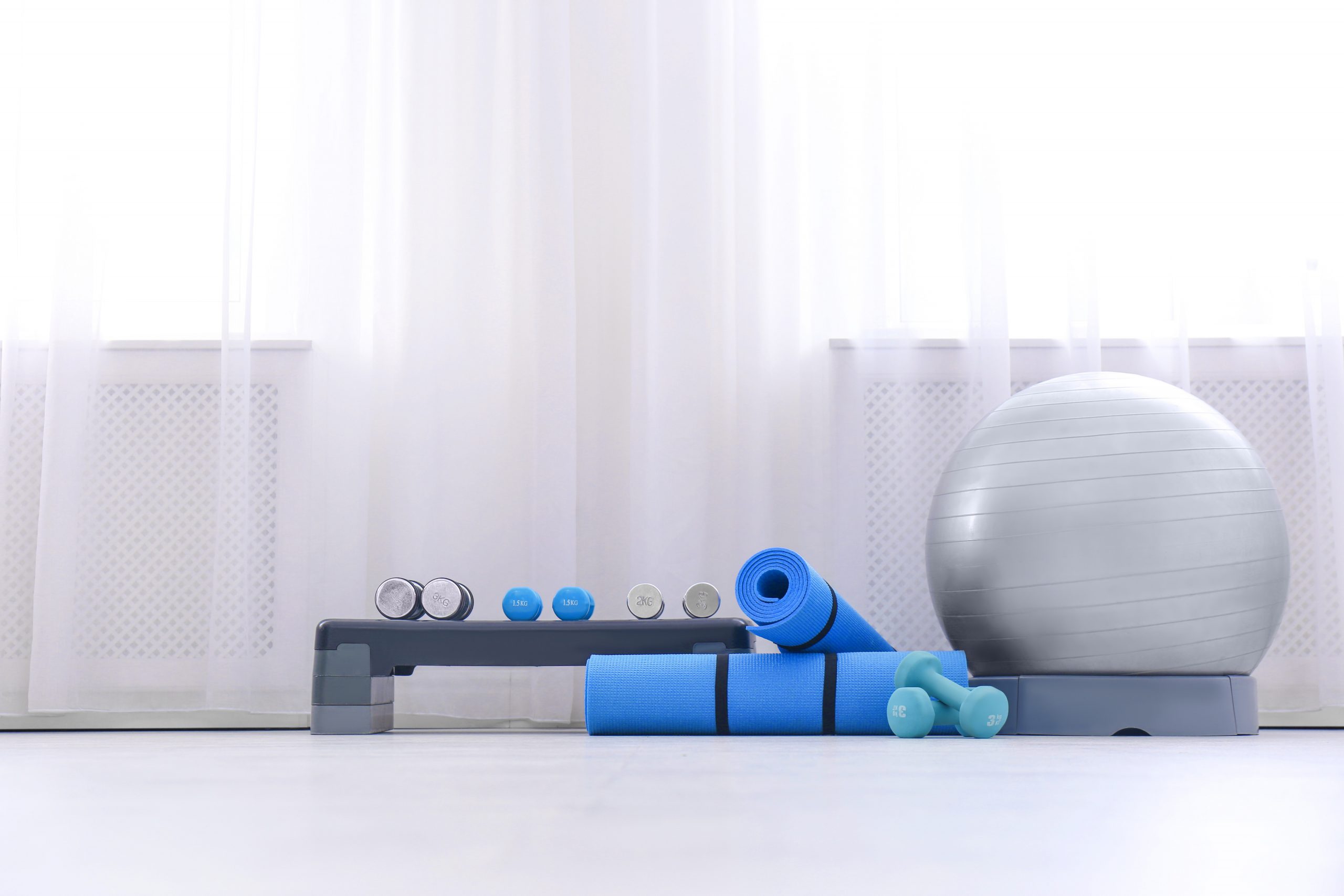 Workout equipment against a backdrop of white curtain